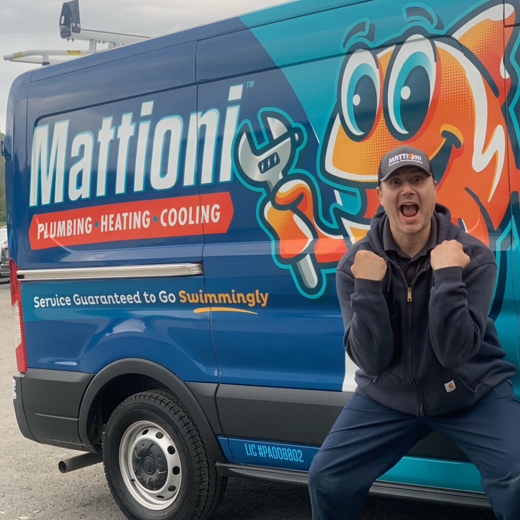 A Mattioni team member in front of the Mattioni service truck